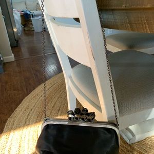 Skull and gem clutch purse